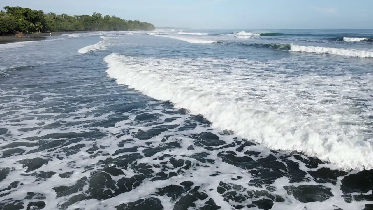 Camera glides over continuous ocean waves