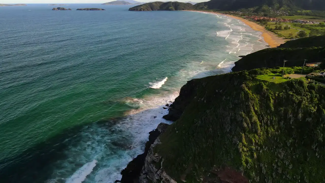 Ocean waves rolling into beautiful natural coastline Geriba beach Buzios Brazil