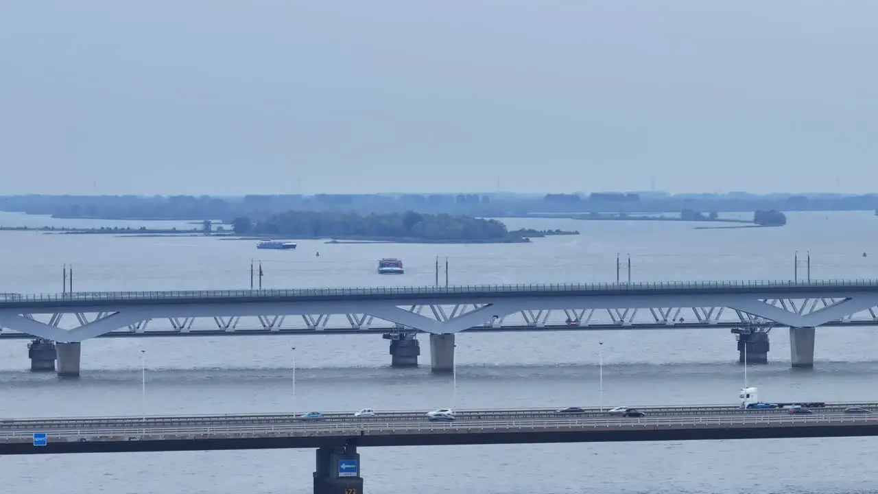 Drone aerial shot panning across with bridges in view and busy cars passing by