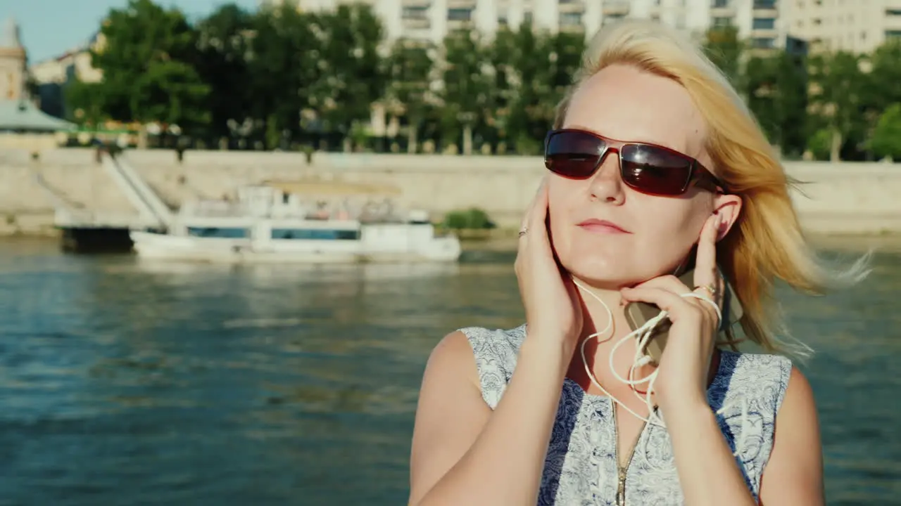 A Woman Listens To Music Sails On A Ship On A Cruise On The Danube