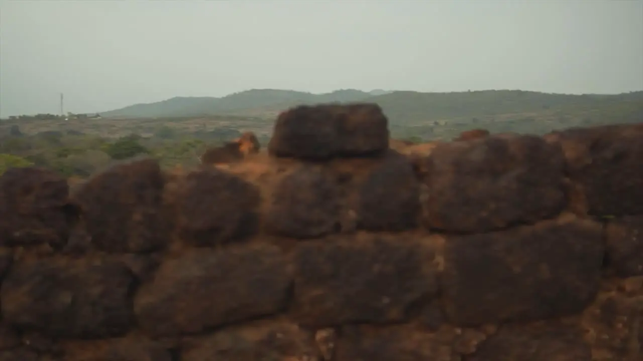 Panoramic View over the bricks of the Ruins of an Old Coastal Fortress and an Ocean Horizon