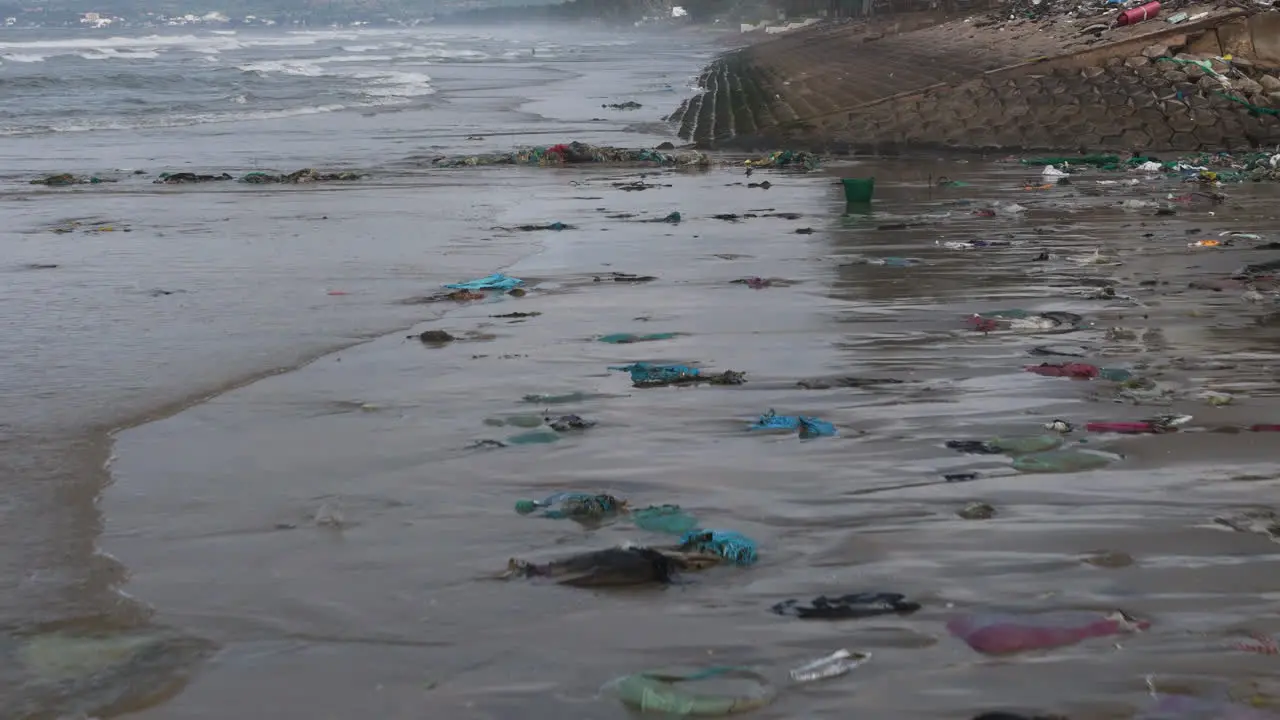 marine pollution concept drone fly close to garbage plastics waste on a sand beach save the planet concept