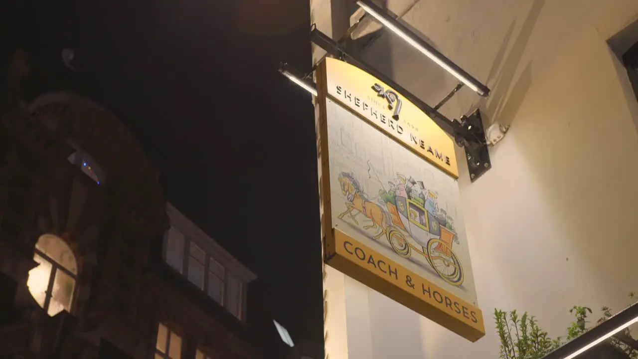 Detail of Pub sign Shepherd neame during night time London England