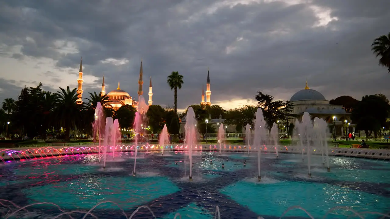 Colour water fountain and Blue mosque Sultanahmet illuminated at night