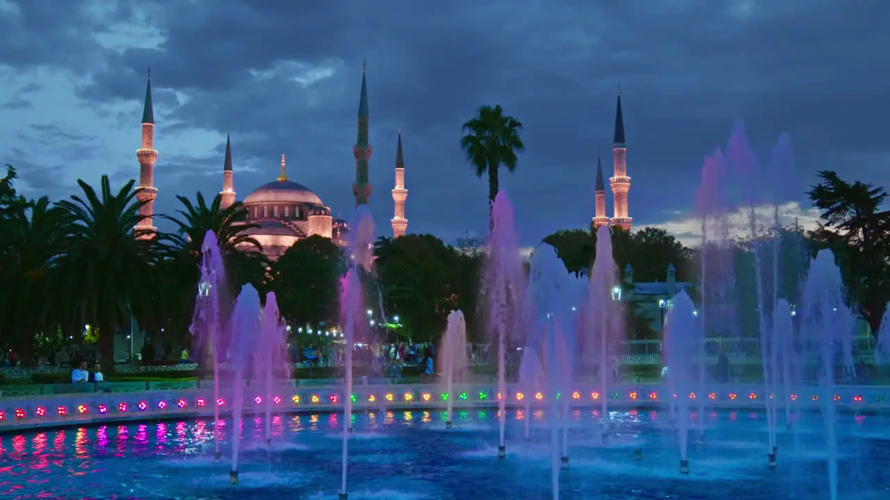 Blue mosque Sultanahmet illuminated at night and water fountains blue hour