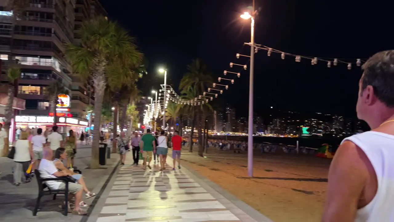 Static shot of main Benidorm strip next to the sandy Levante beach and the Balearic sea Spain 4K 30 fps