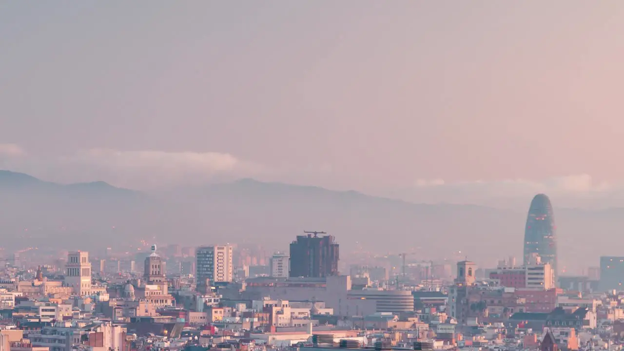 Barcelona skyline detail view torre Agbar view timelapse during winter sunrise aerial views of the city from Montjuic park MNAC viewpoint in Catalonia Spain