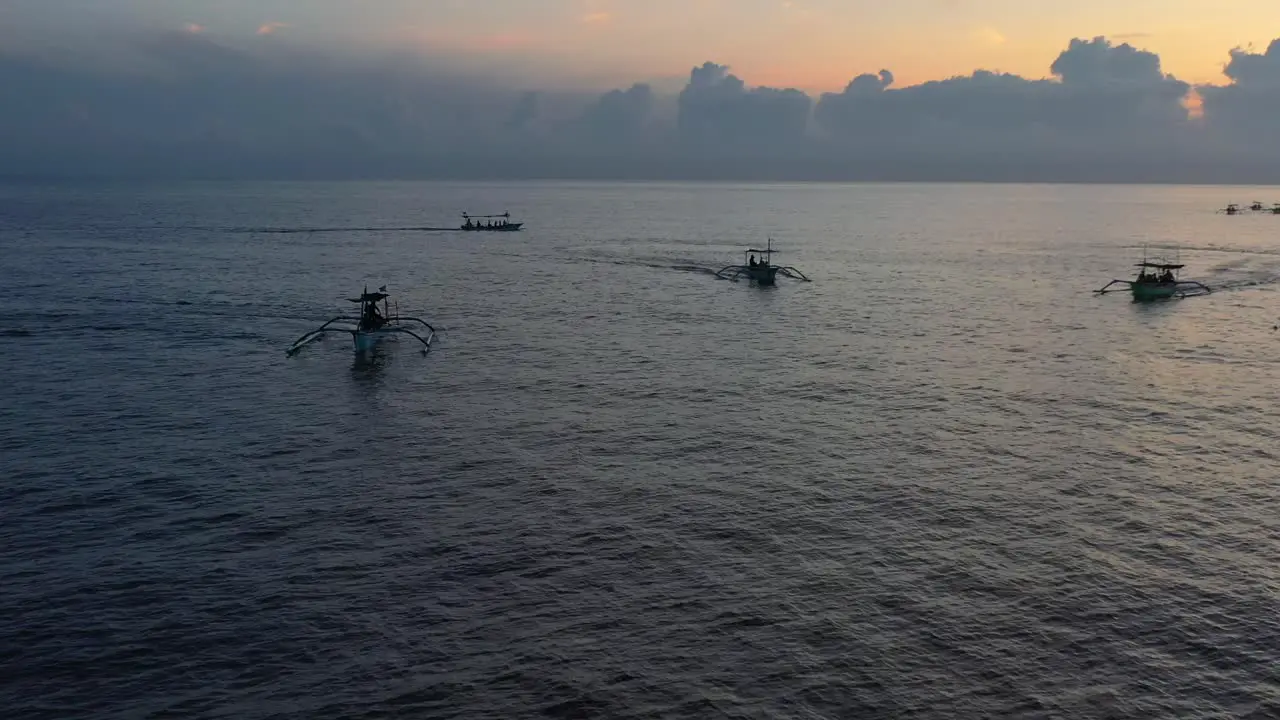 aerial panoramic of indonesian jukung boats on a sunrise ocean tour in Lovina Bali Indonesia