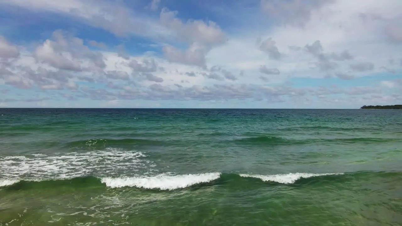 Drone Flyover Scenic Blue Ocean Waves From Costa Rica Beach 4K