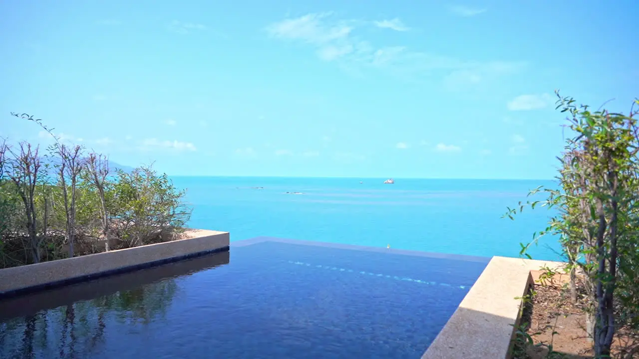 A resort infinity edge pool looks out onto the ocean