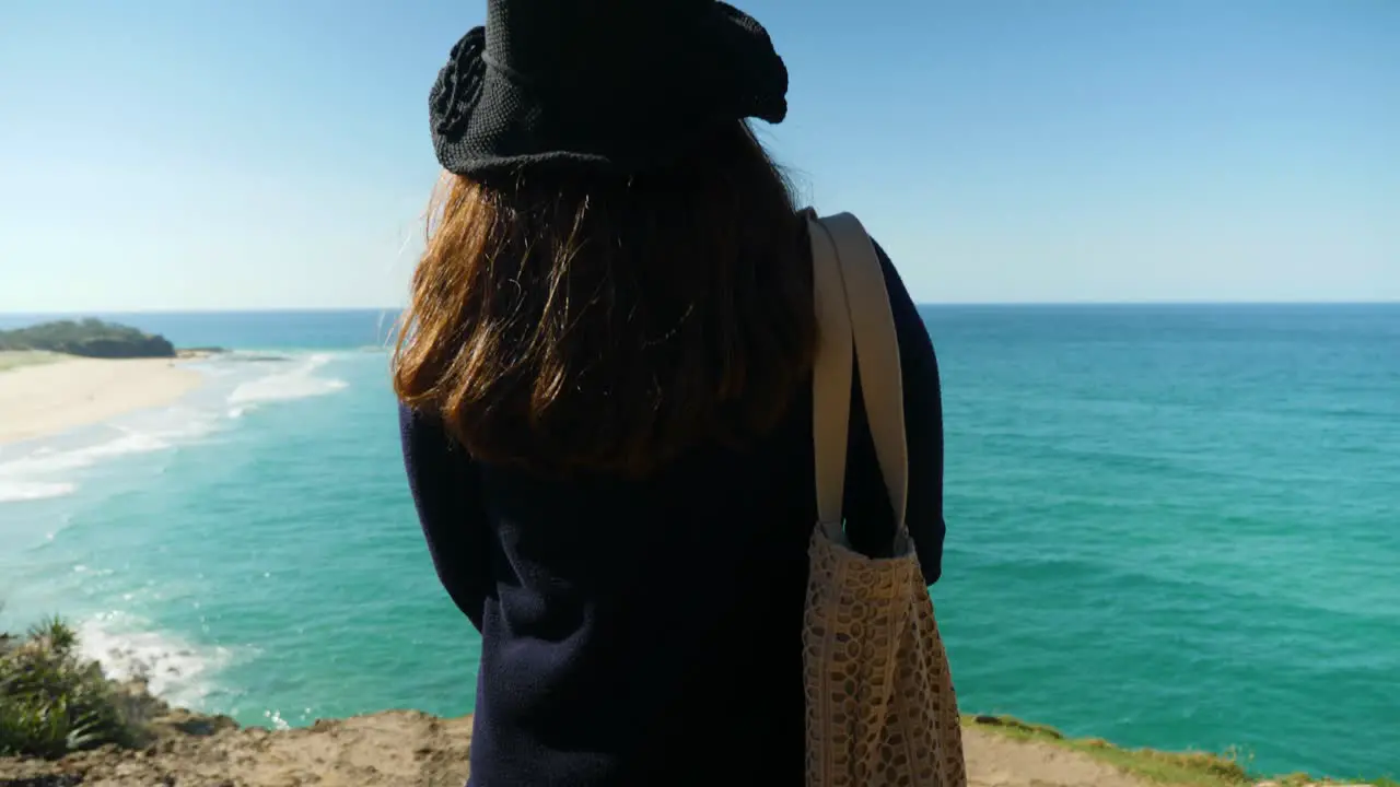 female young asian tourist walking on beach on stradbroke island Brisbane Australia