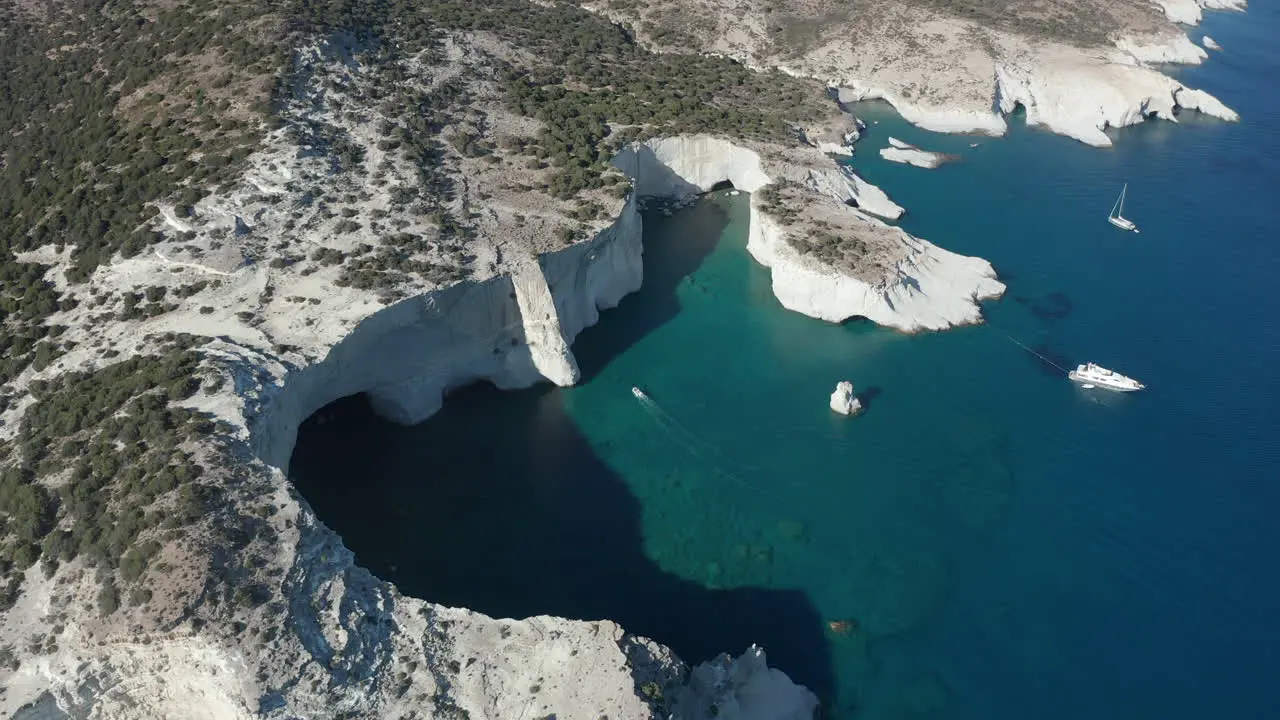 Aerial View facing down on Tropical Island Bay with White Rocks and Caves