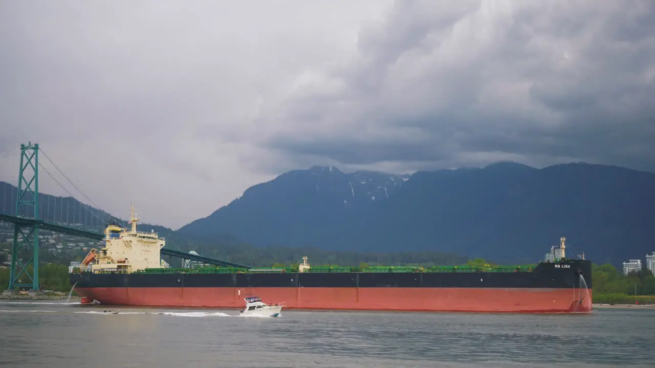 Ocean liner container ship travels through downtown Vancouver British Columbia Canada