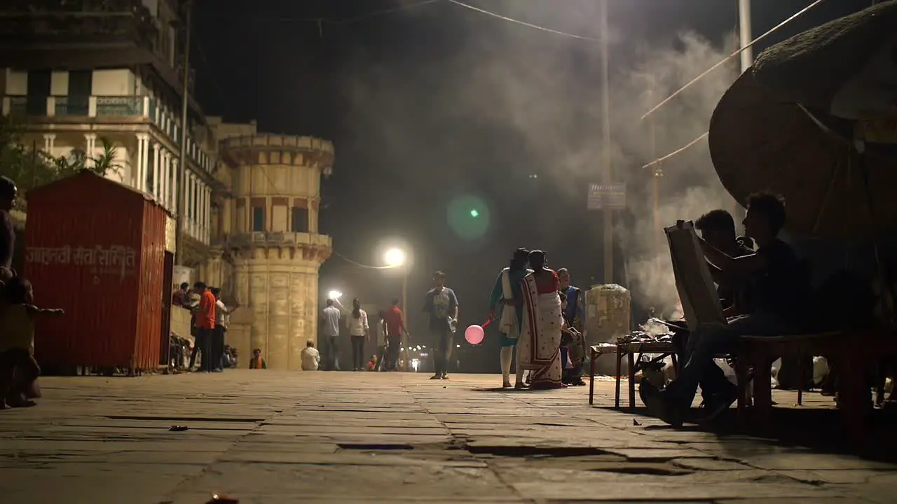 Men and Women on Indian Street at Night