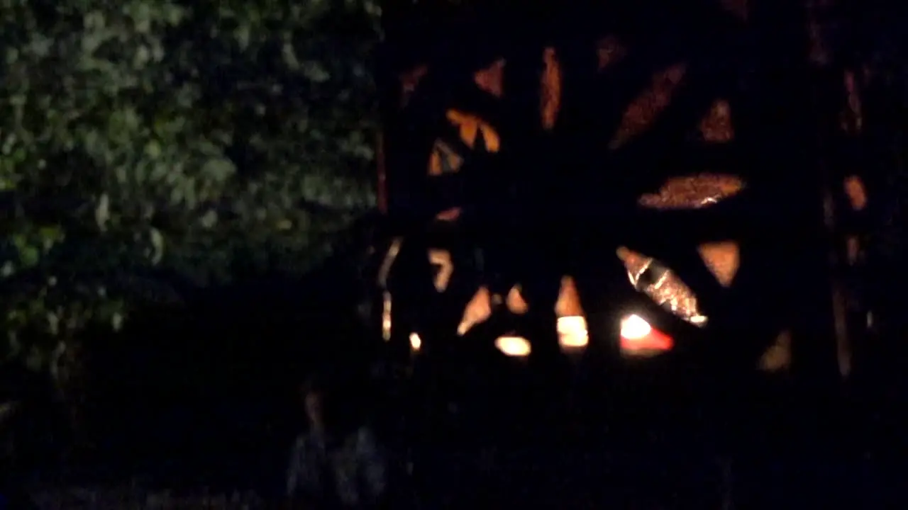 Slow motion of a lantern spinning with a candle inside