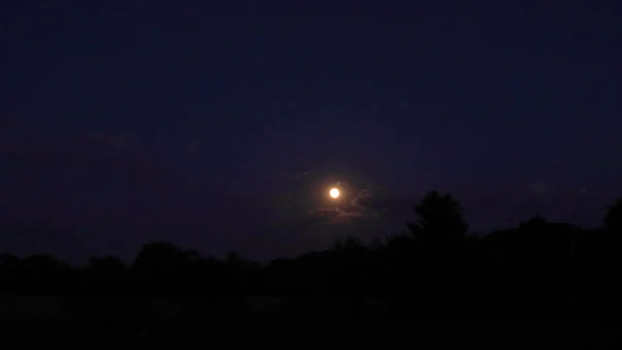 A time lapse of the moon rising just after sunset