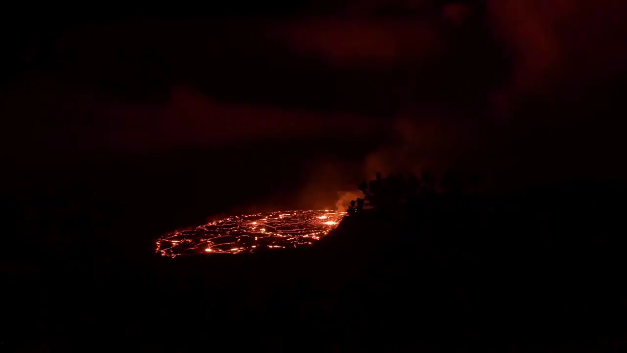 Fresh red lava volcanic eruption in the dark in Kilauea Big Island Hawaii USA