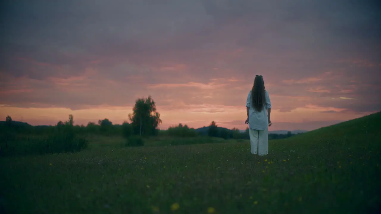 Woman Doing Yoga At Dusk Night