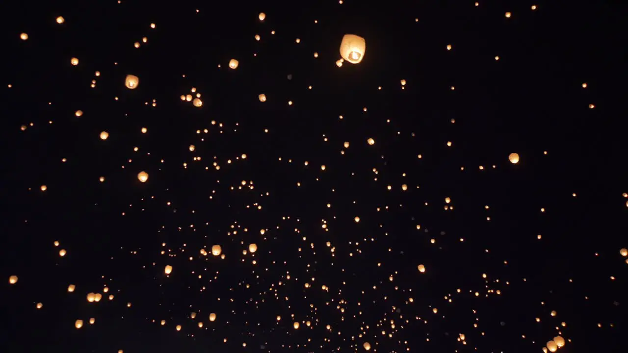 Floating Lanterns in Night Sky