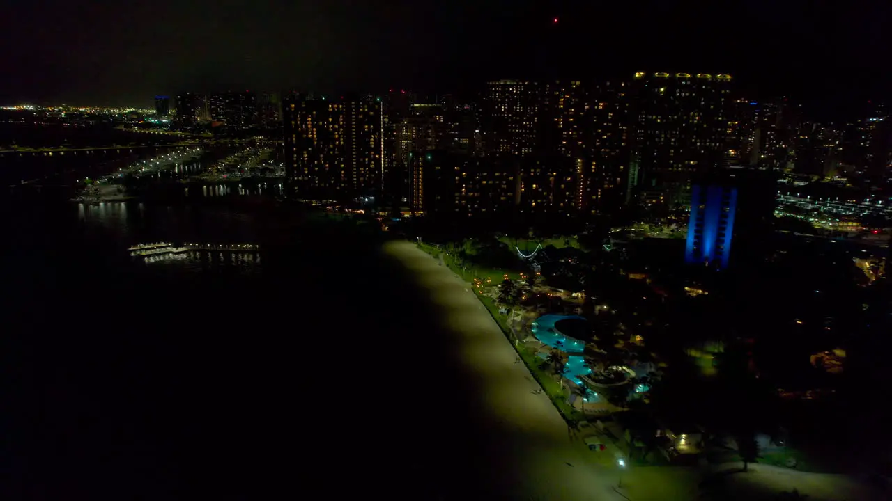 Nighttime view of Fort DeRussy Beach and Kale Hoa hotel with other buildings in Honolulu Hawaii