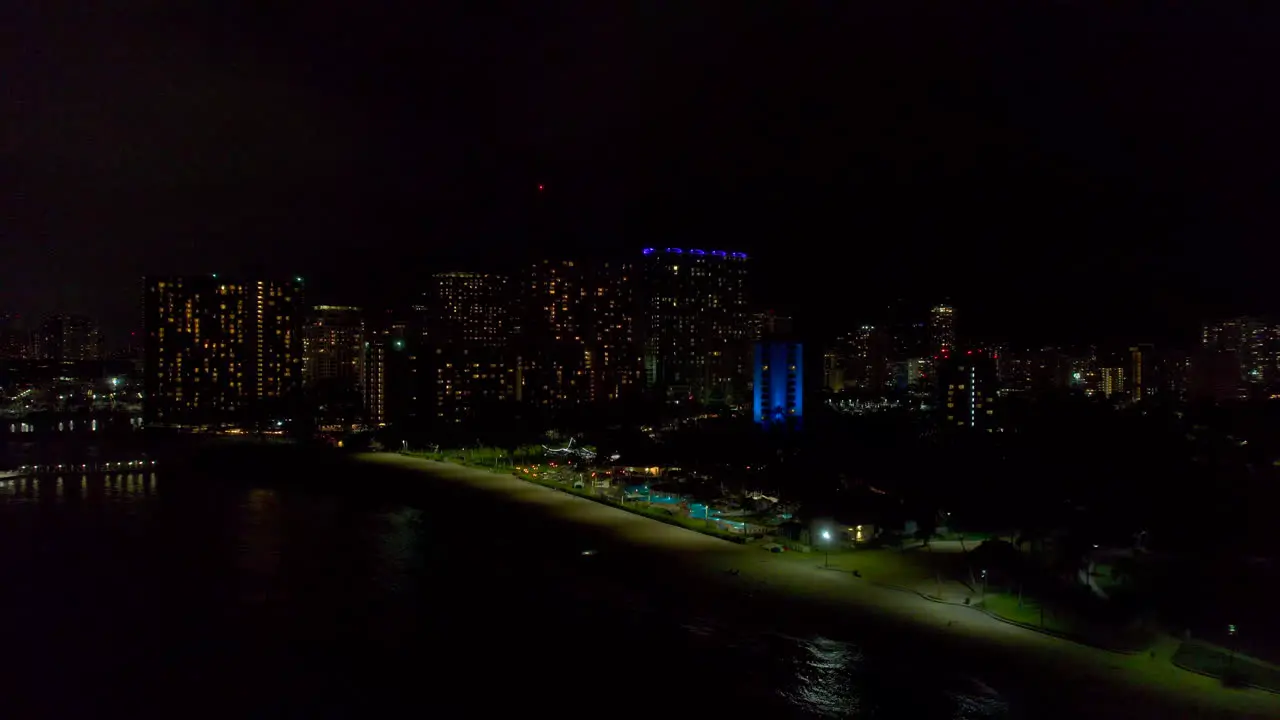 Aerial reveal of Honolulu at night 4k drone