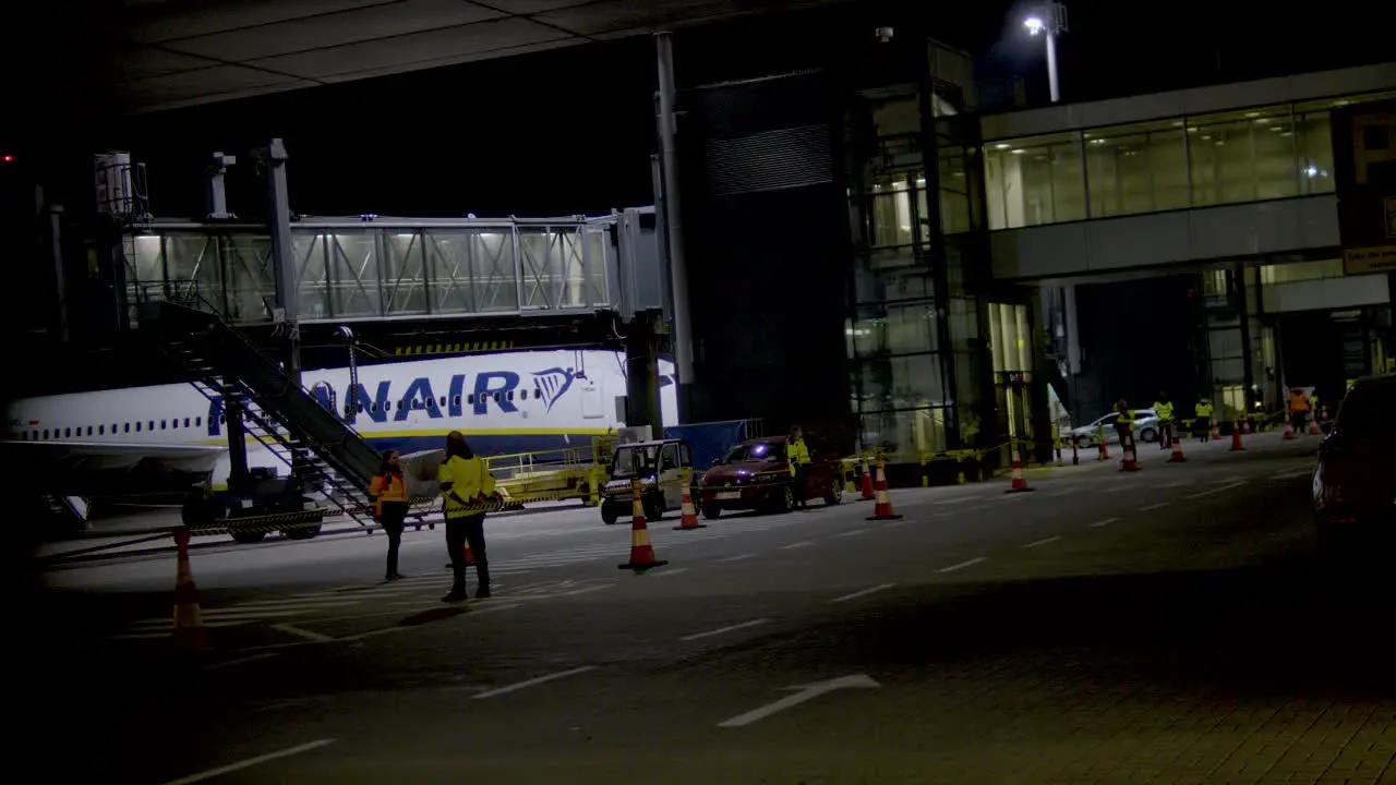 Airport maintenance in anticipation of passengers moving on the runway at night