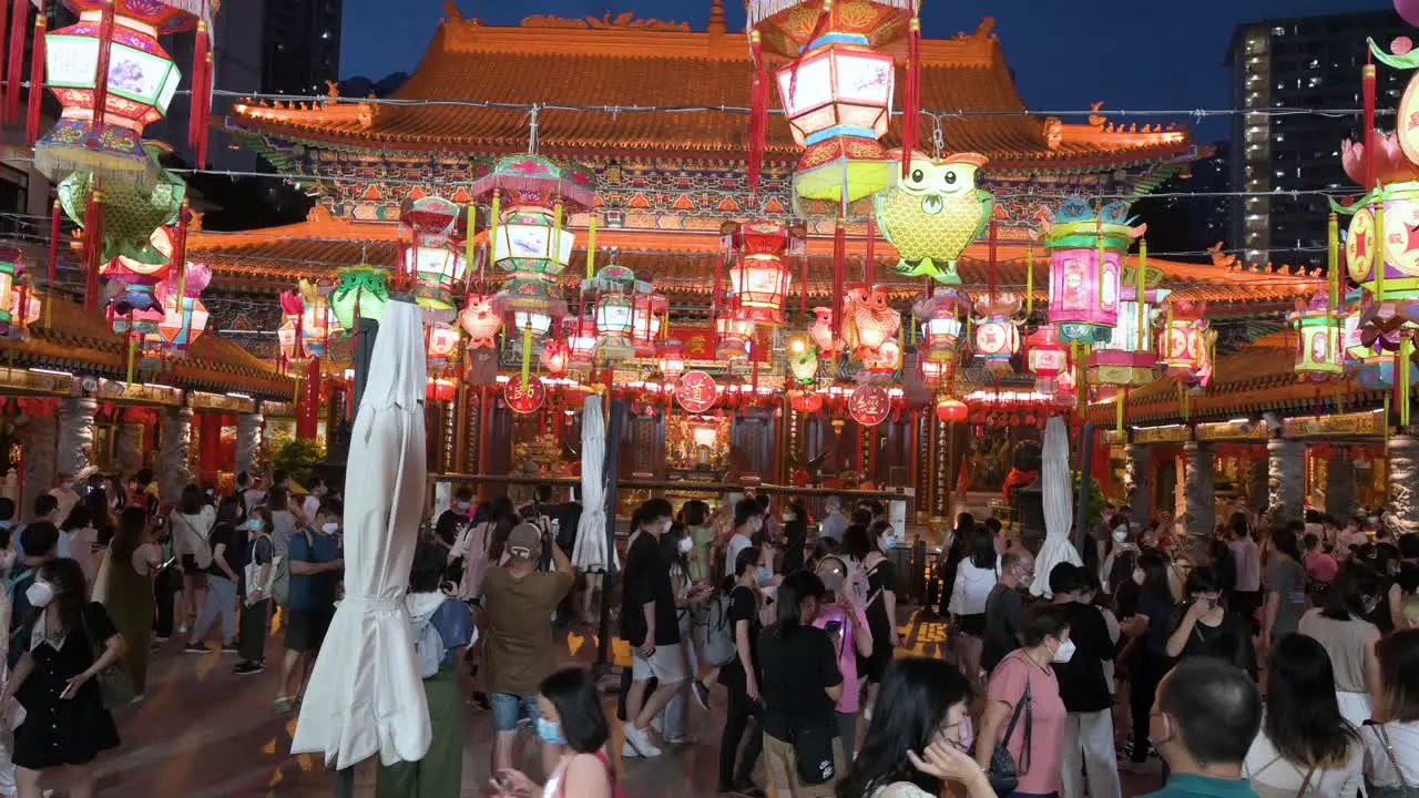 Hundreds of visitors and travelers enjoy a lantern show which symbolizes prosperity and good fortune at the Wong Tai Sin temple to celebrate the Mid-Autumn Festival also called Mooncake Festival