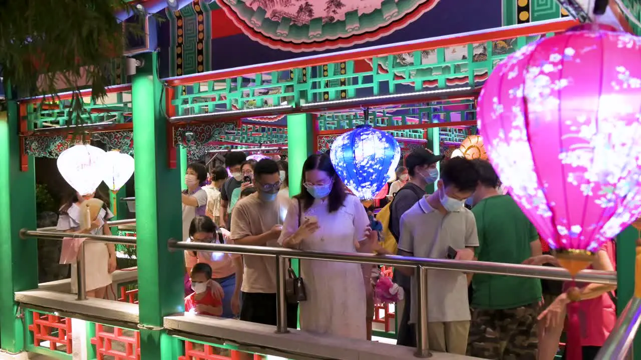 Residents and Chinese visitors are seen at the Wong Tai Sin public park decorated with Chinese lanterns at a nighttime lantern show during the Mid-Autumn Festival 