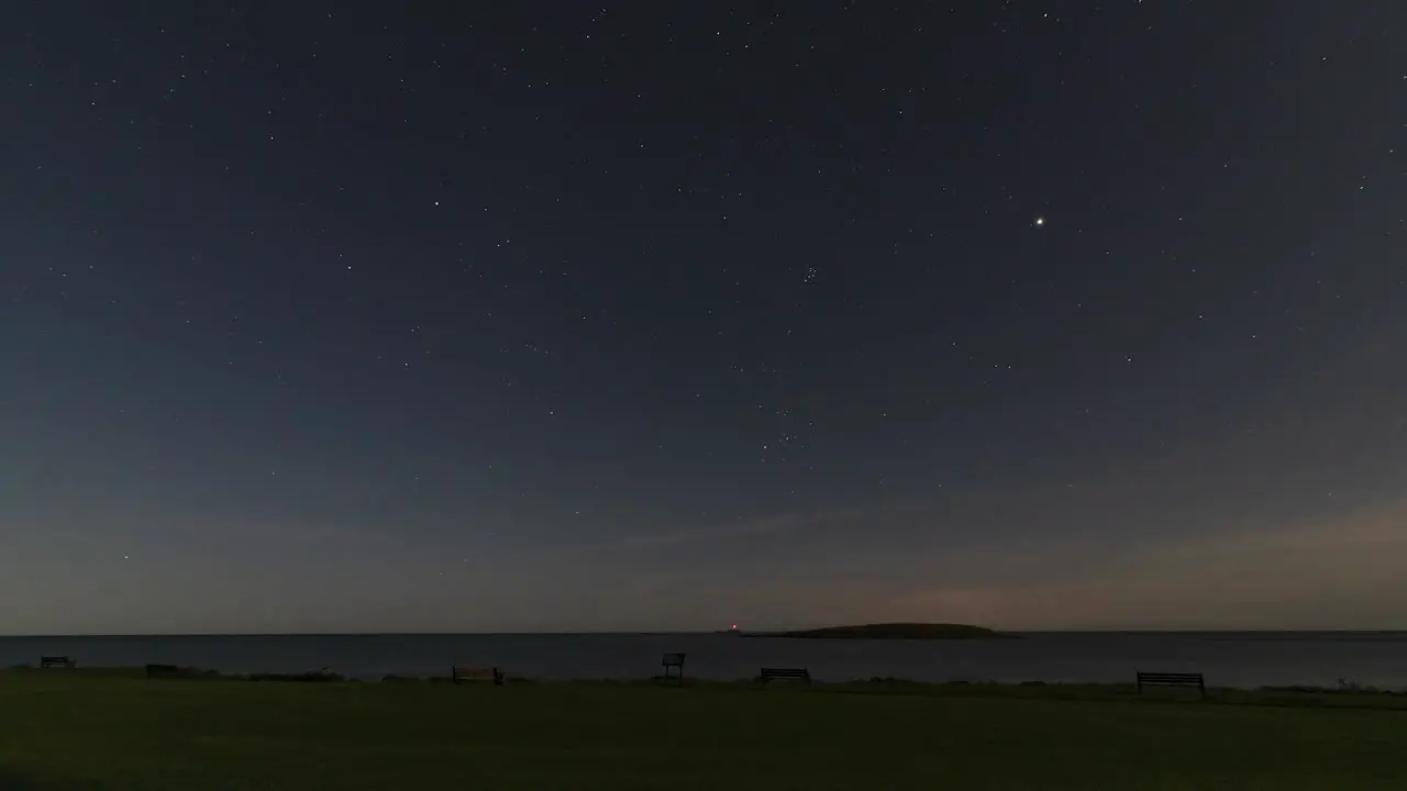 Cosmic Symphony Timelapse of Night Sky Over Skerries Harbour with Stars Planes and Shooting Star Featuring St