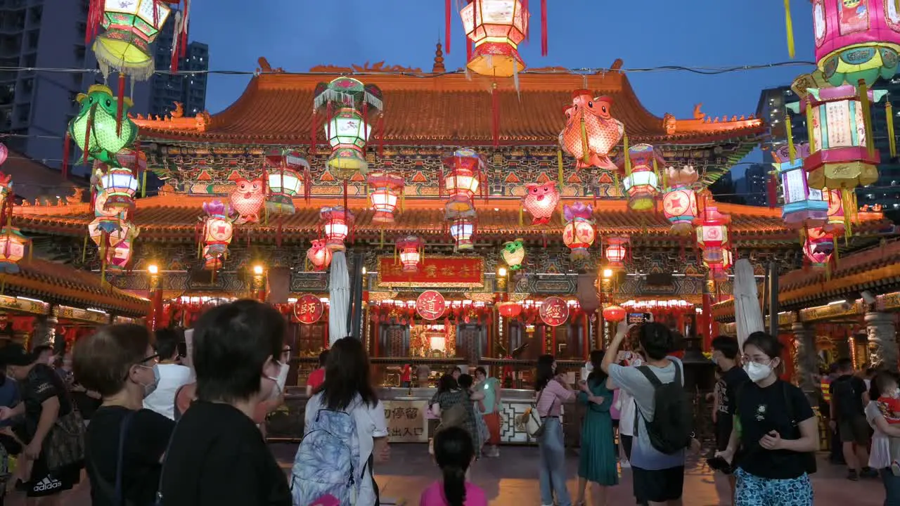 Visitors and travelers attend and take photos during a lantern show which symbolizes prosperity and good fortune at a temple to celebrate the Mid-Autumn Festival also called Mooncake Festival