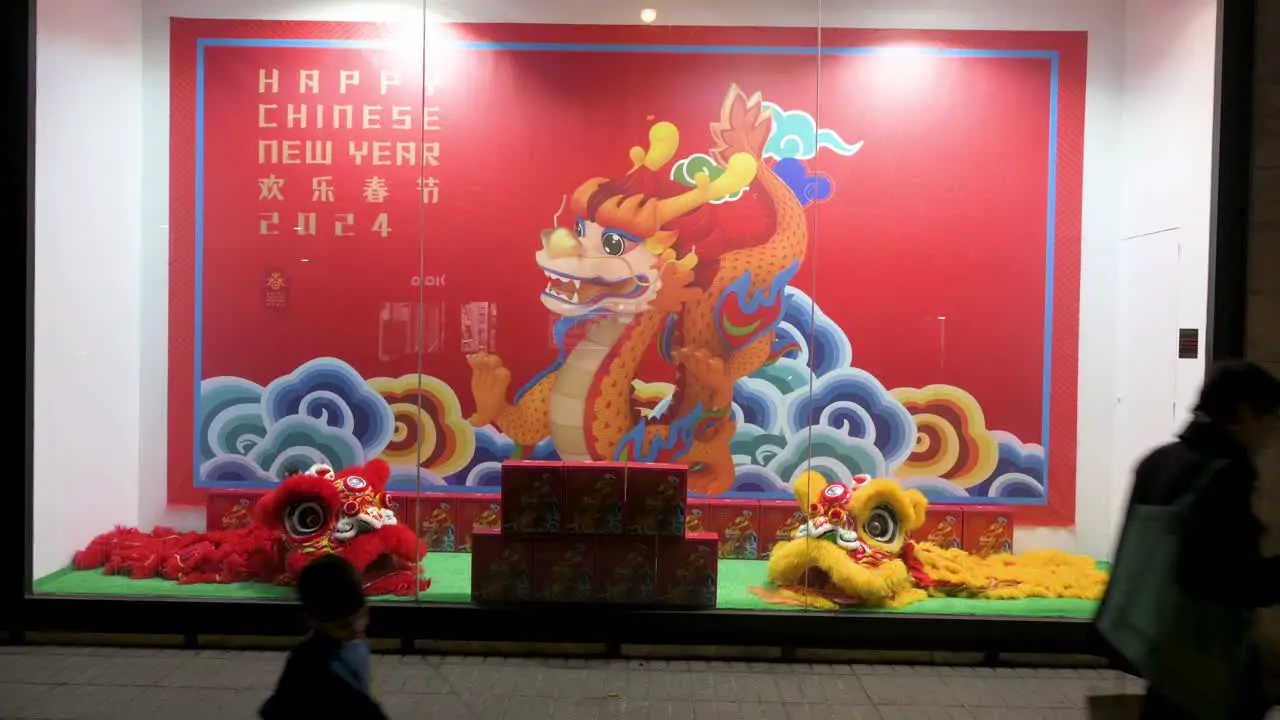 Pedestrians walk past the China Cultural Centre adorned with festive decorations in celebration of the upcoming Chinese Lunar New Year 2022 the Year of the Dragon in Madrid Spain