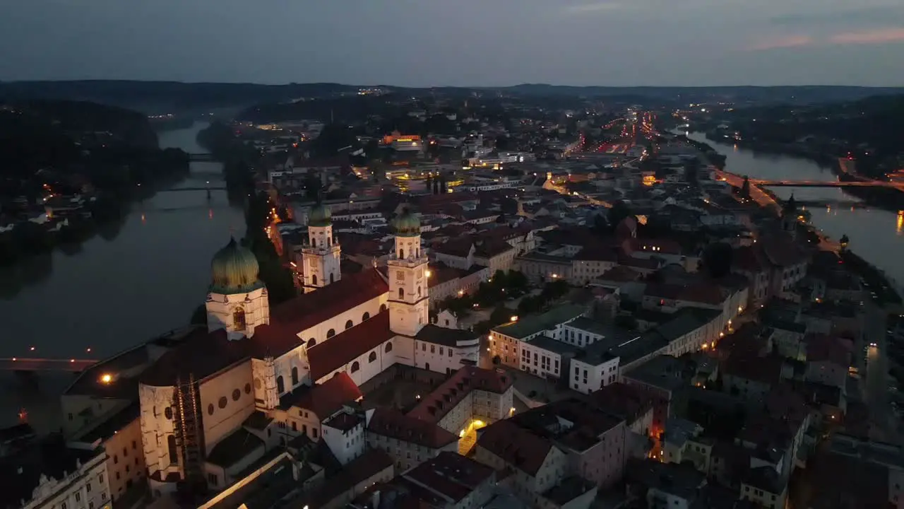 Passau at night with orbiting around city cathedral at sunset