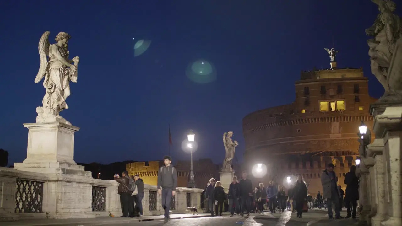 People on Sant Angelo Bridge at Night