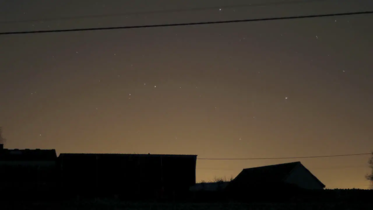 Night Sky Time Lapse with Moving Stars Barn Outline in Foreground