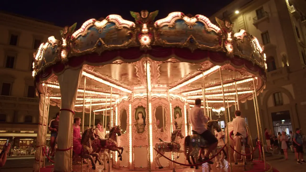 Merry Go Round Carousel in Florence Italy Downtown Piazza della Repubblica Active Medium Shot with People