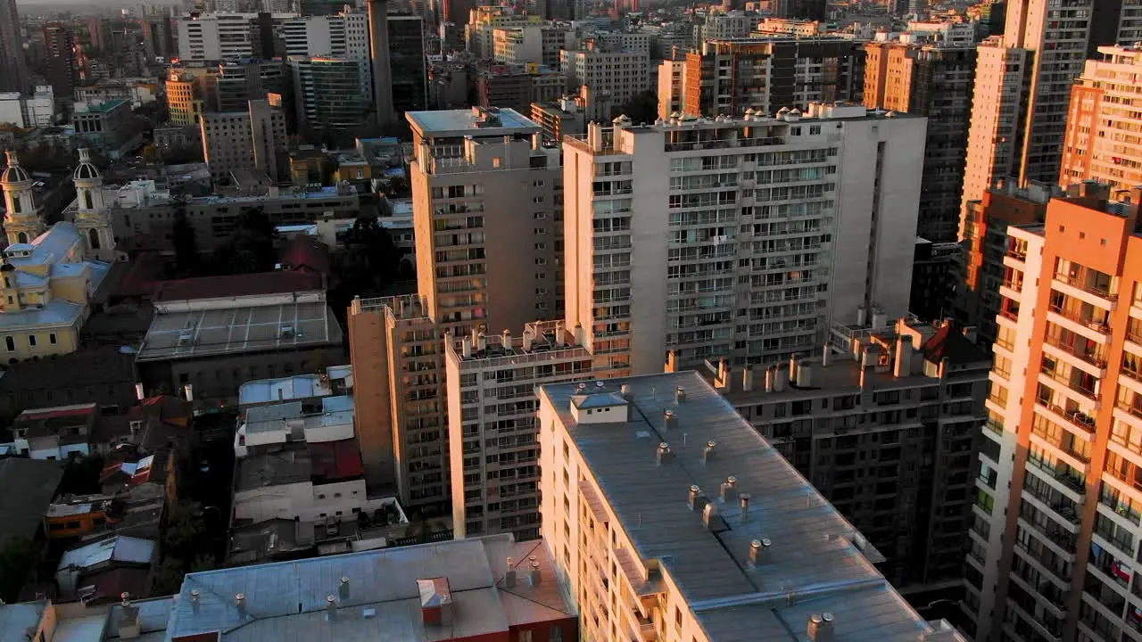 Drone captures bustling Santiago streets at twilight showcasing urban movement and city light