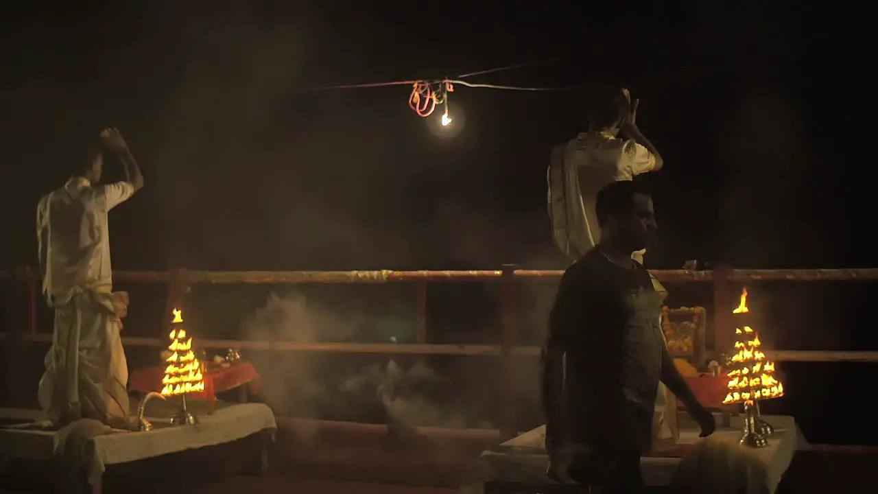 Two Men Perform Ceremonial Synchronised Gestures