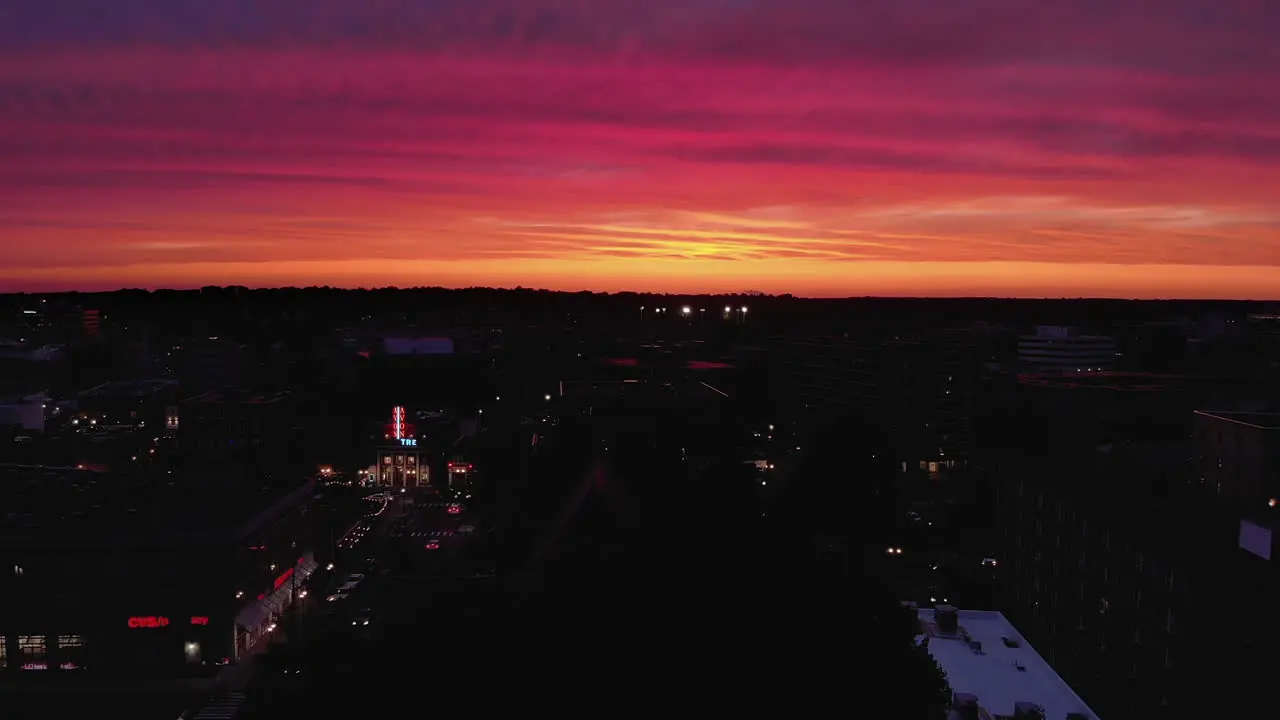 Cars passing through Stamford Connecticut during radiant sunset