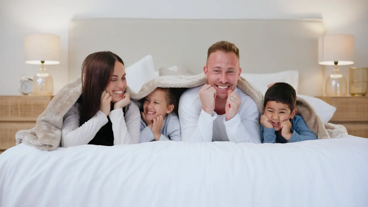 Face blanket and family in a bed happy