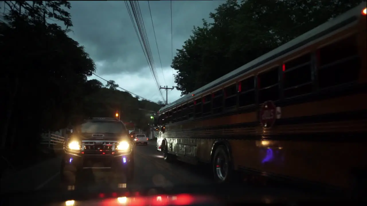 Yellow american school bus at night time traffic in Latin America Honduras