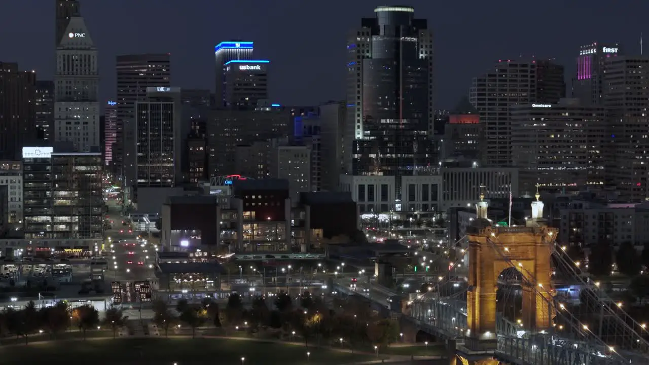 Aerial of Modern US city Cincinnati at night establish shot