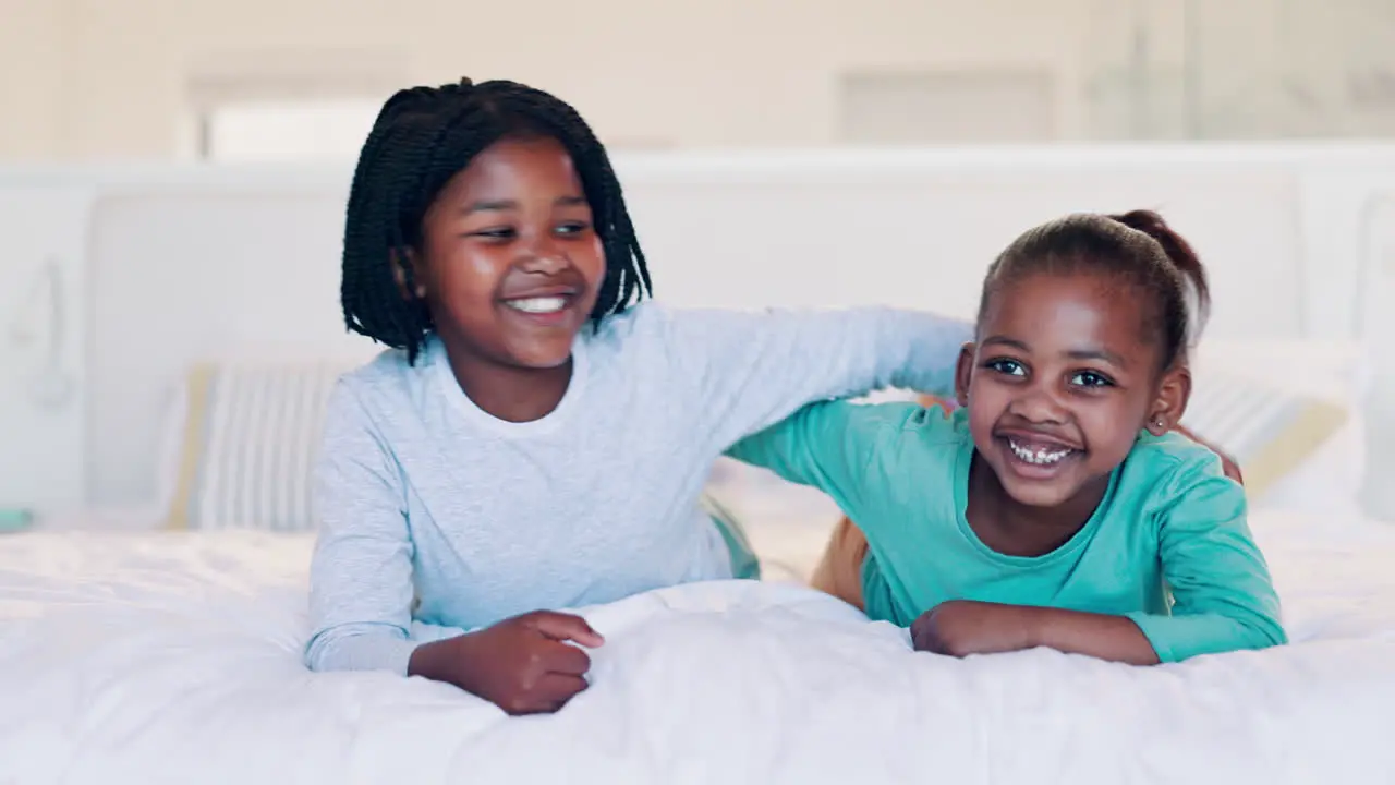 Children siblings and face on bed in home