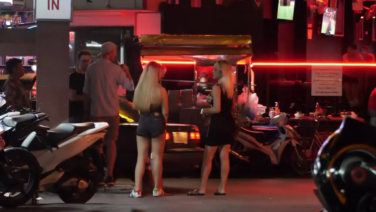 2 streetwalkers waiting for cars in Nana Plaza soi 4 Bangkok