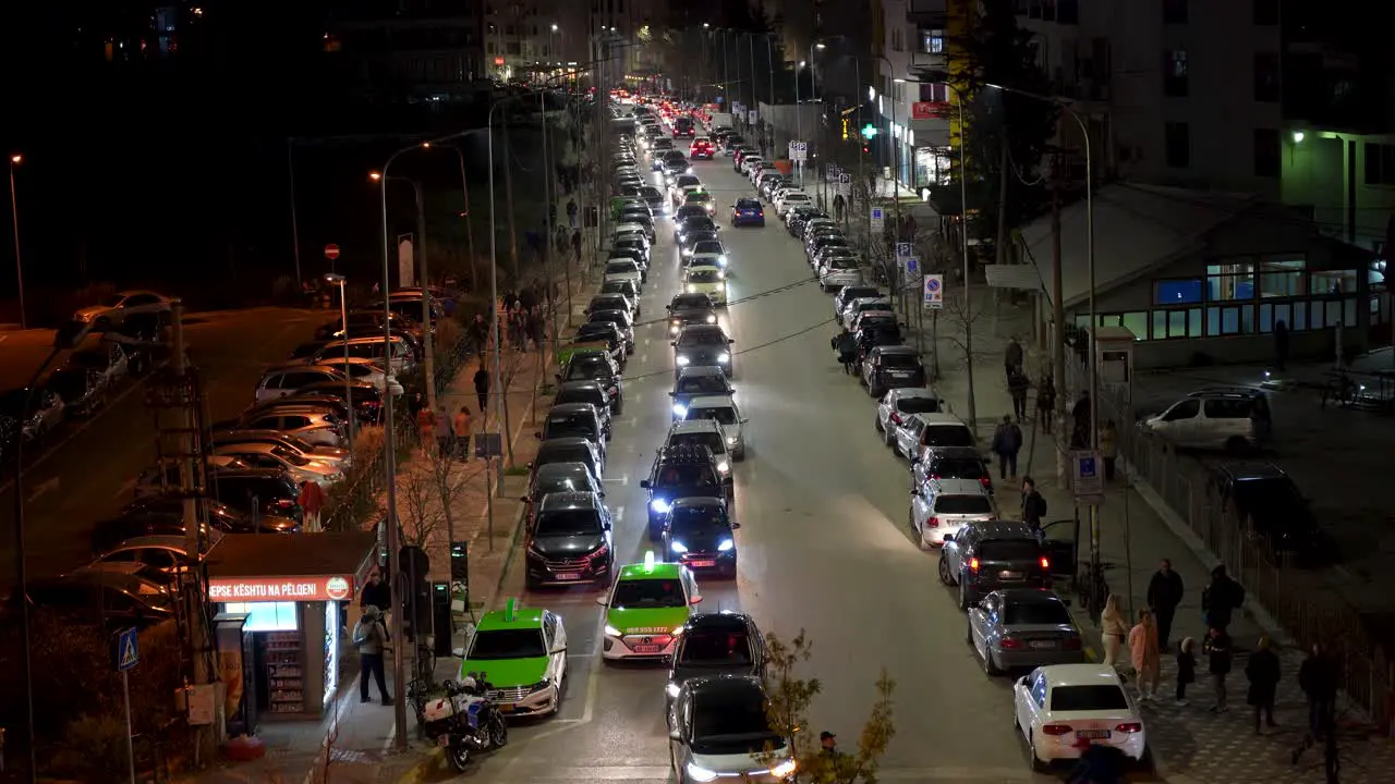 Nighttime Scene of Busy Traffic and Cars on the Streets of Tirana A Bustling Metropolis at Night