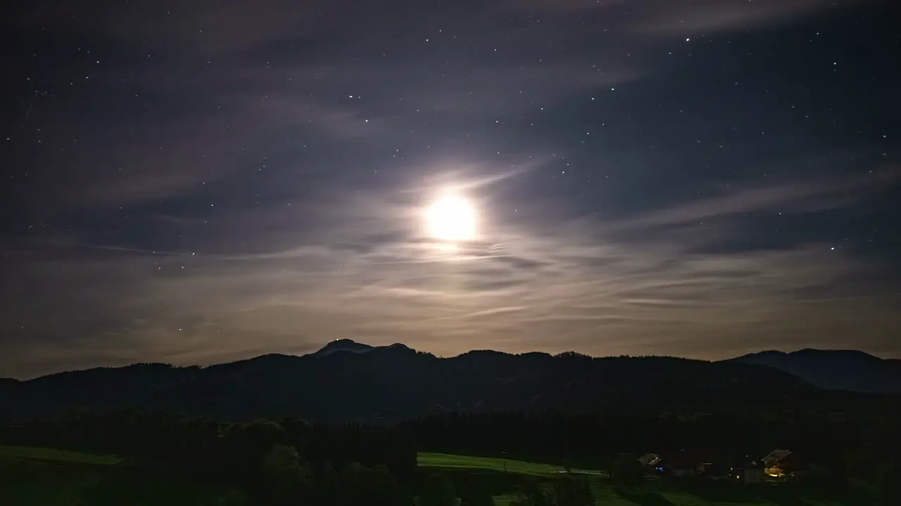 Luminous moon and stars grace the Austrian Alps in a mesmerizing timelapse