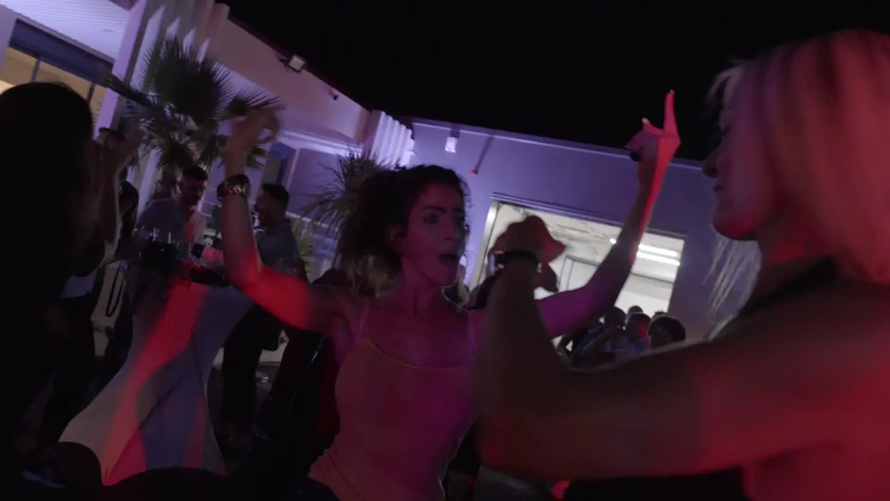 Group of sexy women enjoy dancing together at an anniversary party nightlife