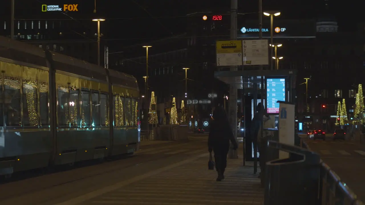 Tram stop on the streets with christmas light at night