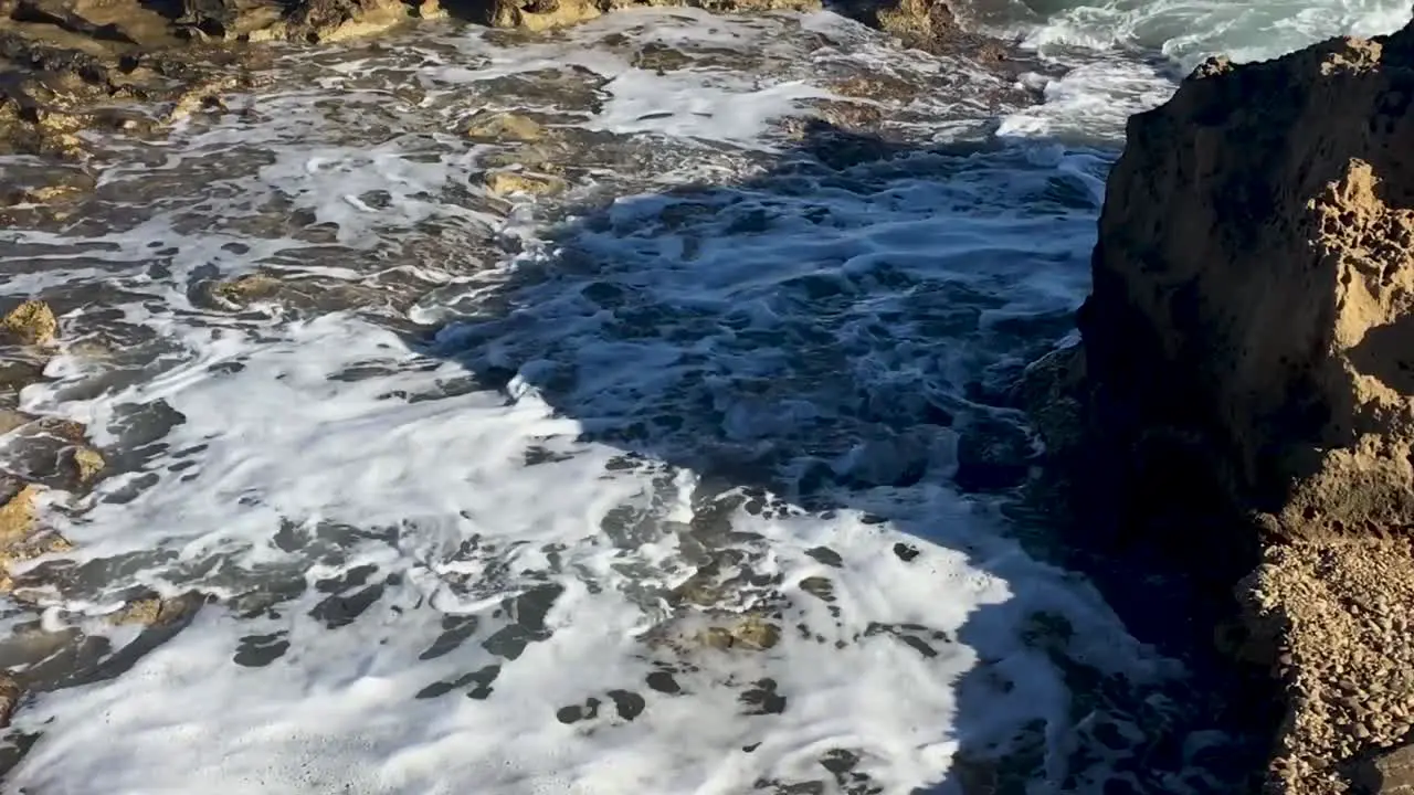 Waves Crashing in Rock Pools in the Sea