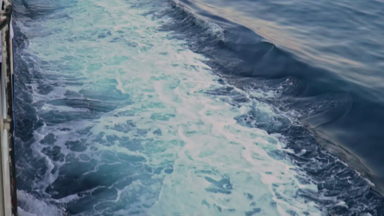 Tilt shot of churning waters made by ferry boat traveling at sea of Argosaronikos Greece 120fps