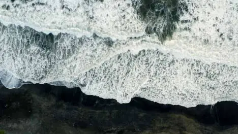 Drone Shot Ascending Above Waves at Pigstone Beach